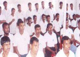 Candidates in white shirts seated at an orientation session