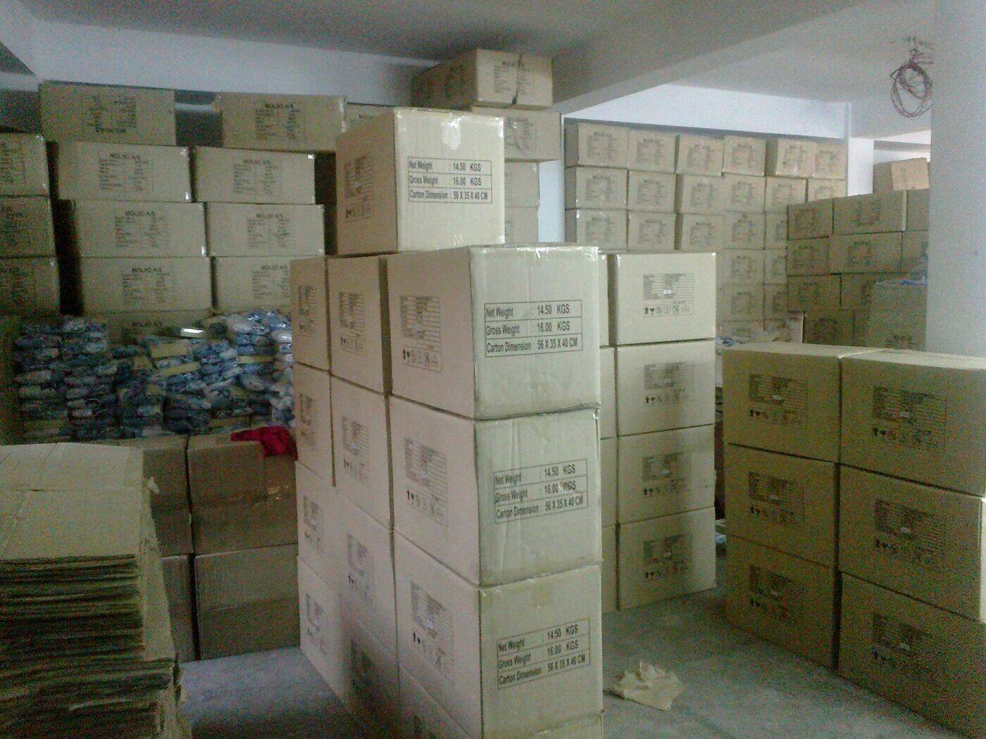 Stacks of packed export cartons in the main store