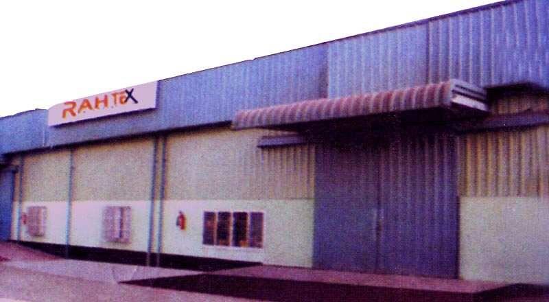 Exterior of the Rahtex textile factory building with the Rahtex sign